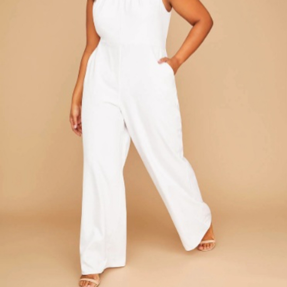 Lane Bryant Jump Suite White size 24 with pockets and wide leg. Suit is white.